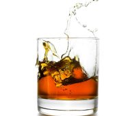 whisky-glass-with-splashes-isolated-on-white-2023-11-27-05-15-24-utc